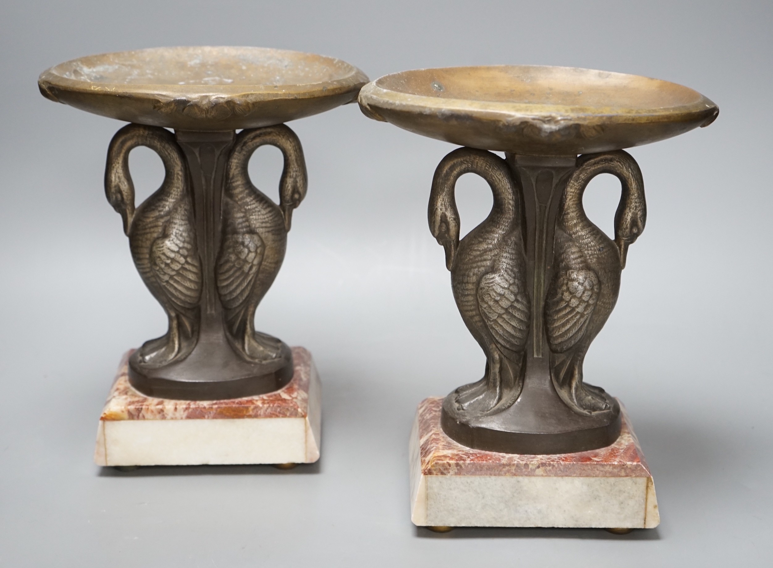 A pair of Art Deco spelter and marble ‘swan’ garnitures, 24cm